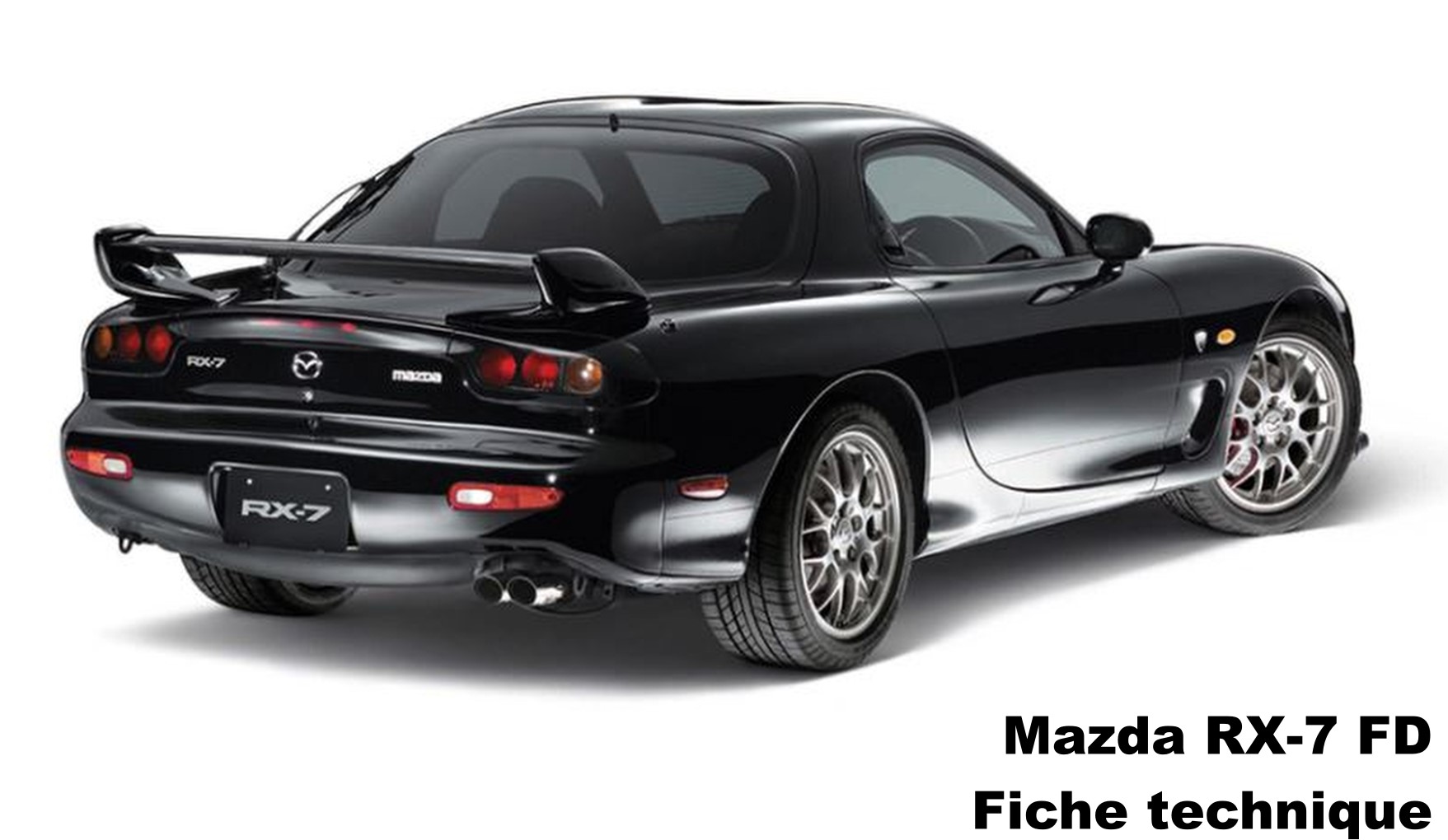 Mazda RX-7 FD noire vue arrière trois-quarts, coupé sportif japonais à moteur rotatif biturbo