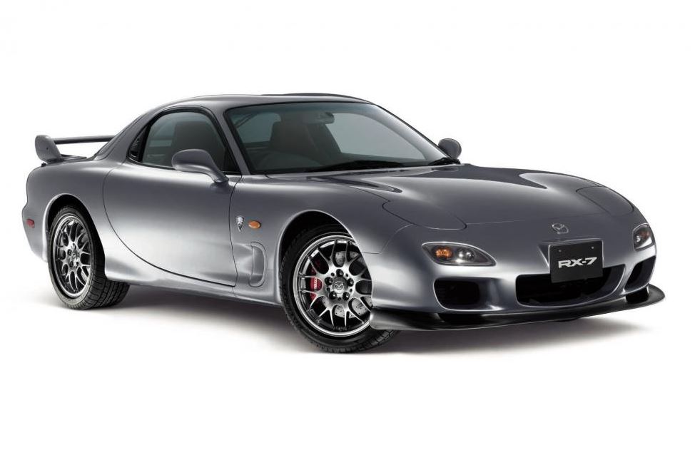 Mazda RX-7 FD grise vue avant trois quarts en studio